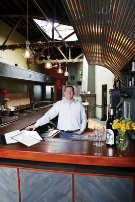 Derek Rettell standing in the kitchen at one of his Chicago locations