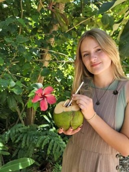 Chloe Powers holding a coconut
