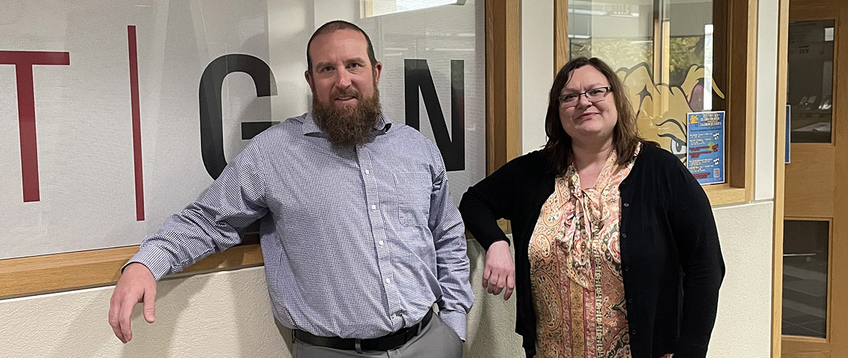 Dave McCall and Jenny Jakulin standing side-by-side.