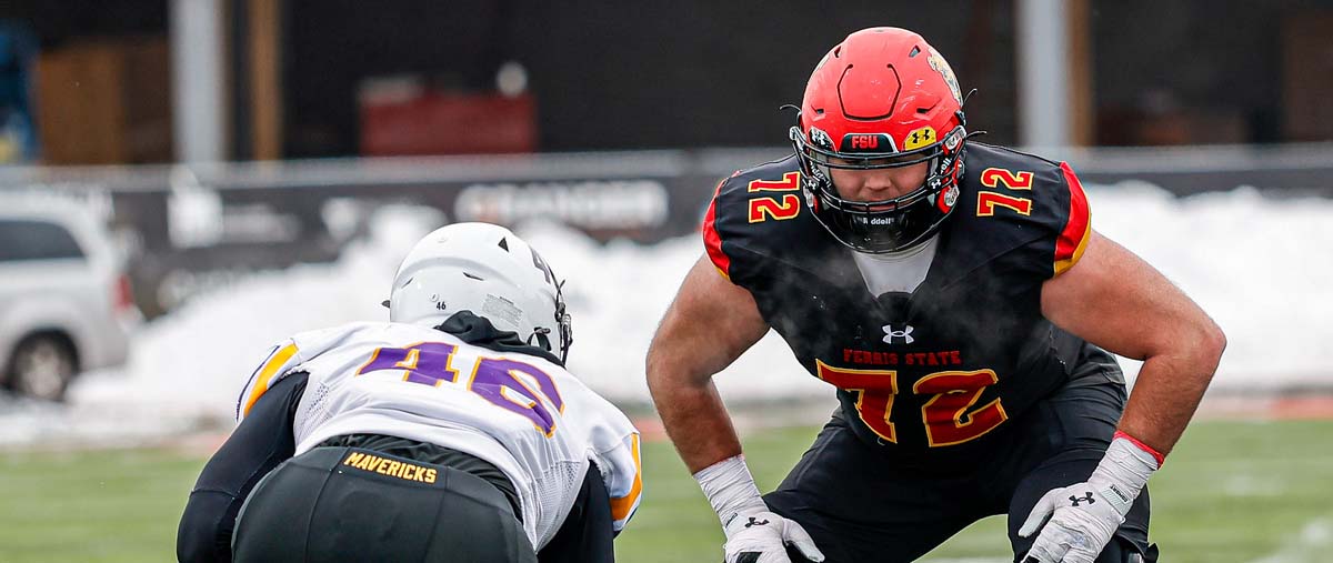 Anderson lining up against a Minnesota-St. player during NCAA Playoffs