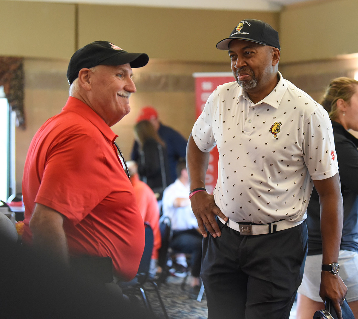 Ferris State Class of 1979 College of Pharmacy alum Andy Young (left) stands with Ferris State President Bill Pink (right) during the 2023 Alumni Golf Outing at Clio Country Club in Clio, Michigan. The 2024 event will be held in Big Rapids in conjunction with the 50th anniversary of Katke Golf Course on the Ferris State campus.