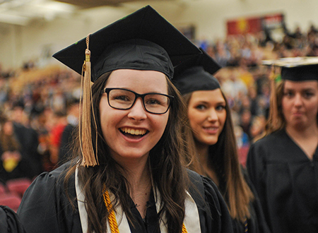 Smiling Ferris State University graduate