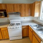 Kitchen with Stove, Oven, Sink, Microwave and multiple storage spaces an kitchen cabinets for storage
