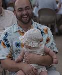 Man laughing with a child