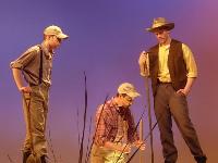 Three men fishing by the river 