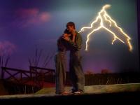 Hugging with lightning in the background