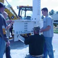 Welding & Construction Students with Grounds Crew Erect SSTS