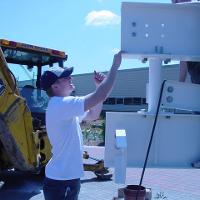 Welding & Construction Students with Grounds Crew Erect SSTS