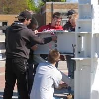 Welding & Construction Students with Grounds Crew Erect SSTS