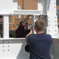 Welding & Construction Students with Grounds Crew Erect SSTS