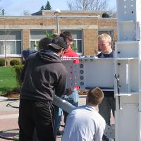 Welding & Construction Students with Grounds Crew Erect SSTS