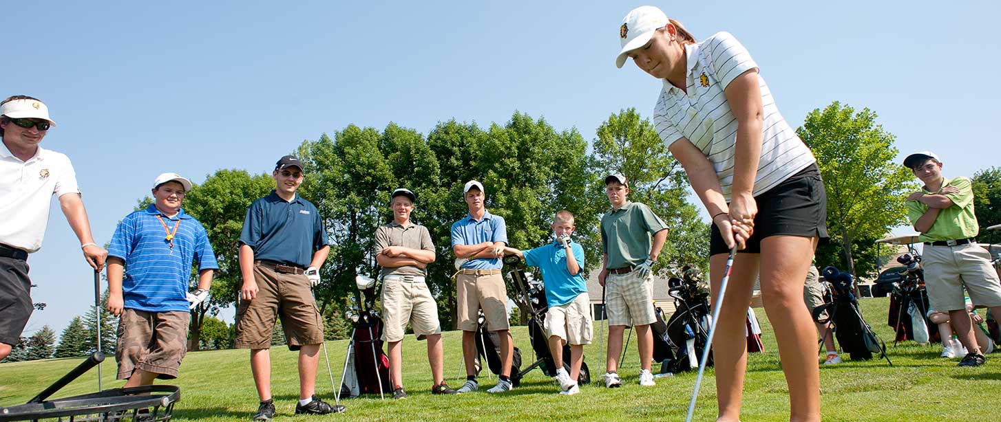 Student practicing golf