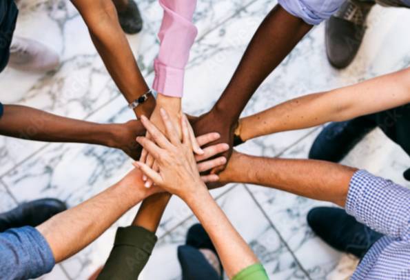 People with their hands in a circle