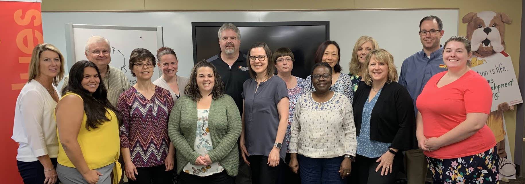 Staff posing in the Center for Staff Development