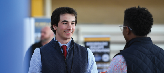 Student speaking with an employer.