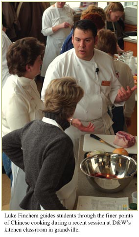 Luke Finchem guides students through the finer points of Chinese cooking