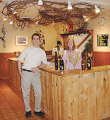 Andrew Grimm and Cristy Catlett welcome visitors to Chateau de Leelenau's Frankenmuth tasting room