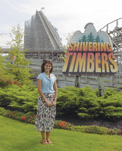Camille Jourden-Mark standing in front of Shivering Timbers roller coaster