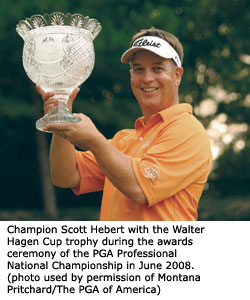 Champion Scott Hebert displays the Walter Hagen Cup trophy