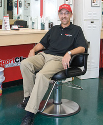 Stacey Patulski sitting in a barber's chair