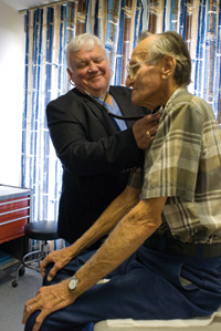 Dr. Ron Mahoney examines a patient