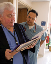 Dr. Ron Mahoney checks a patient's records