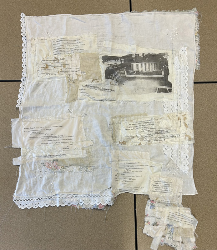 A series of images and indecipherable text printed on white linen fabric