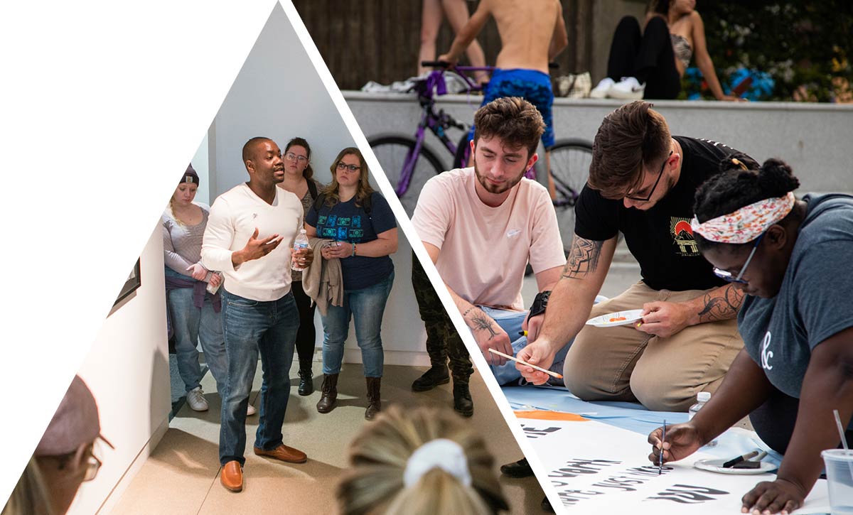 A group of people drawing on a large shee tof white paper. 