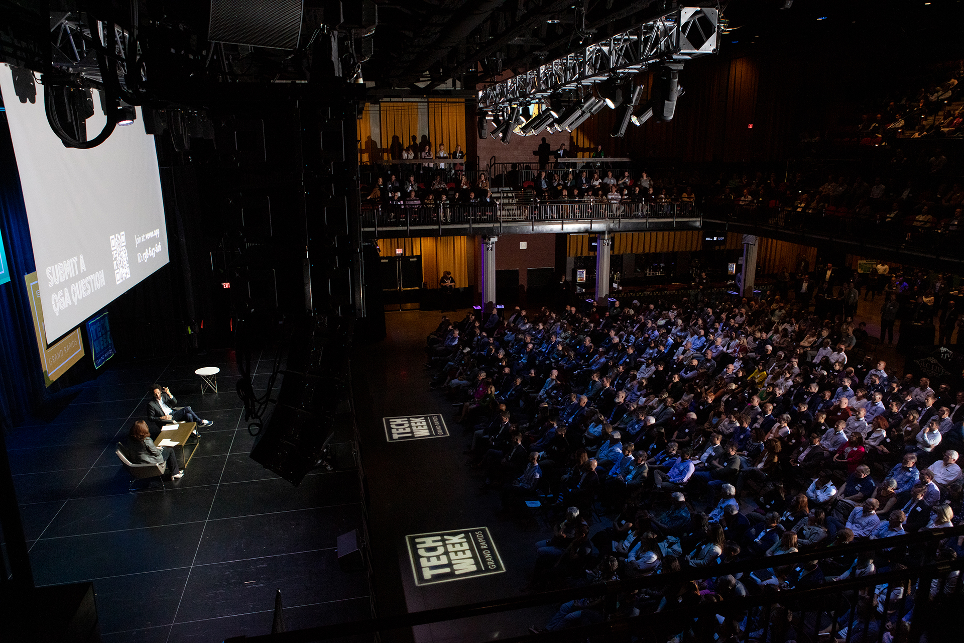 Birds eye view of a stage and audience at a Tech Week Grand Rapids event
