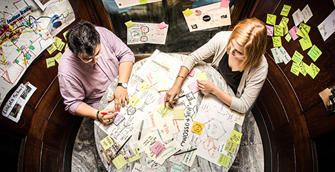 Two people working at a table