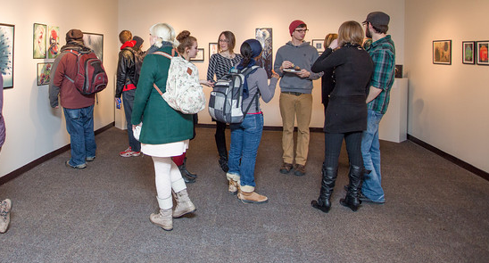 Attendees at a gallery exhibition