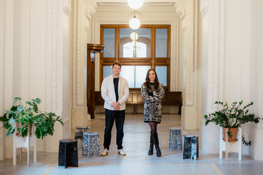 male and female standing in hallway