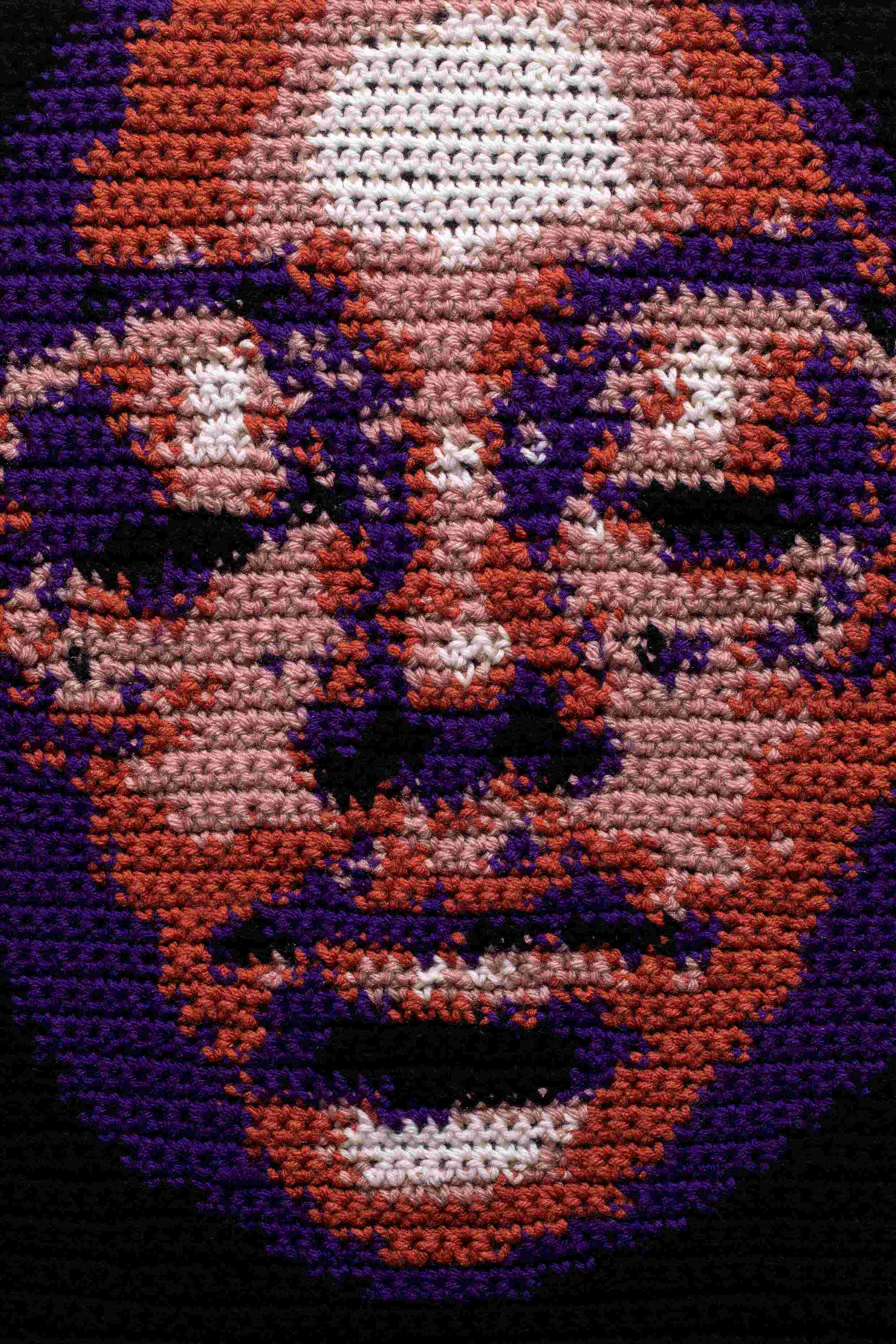 fiber art panel of female face