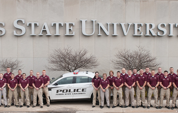 Criminal Justice students in front of Ferris sign