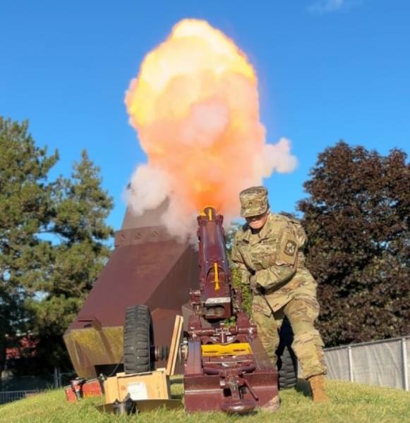 Ferris cadet firing the cannon at a Ferris football game
