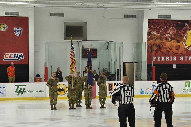 Cadets display the national colors at a Ferris hockey game