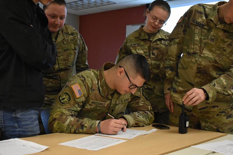 Cadets filling out a 9-line card