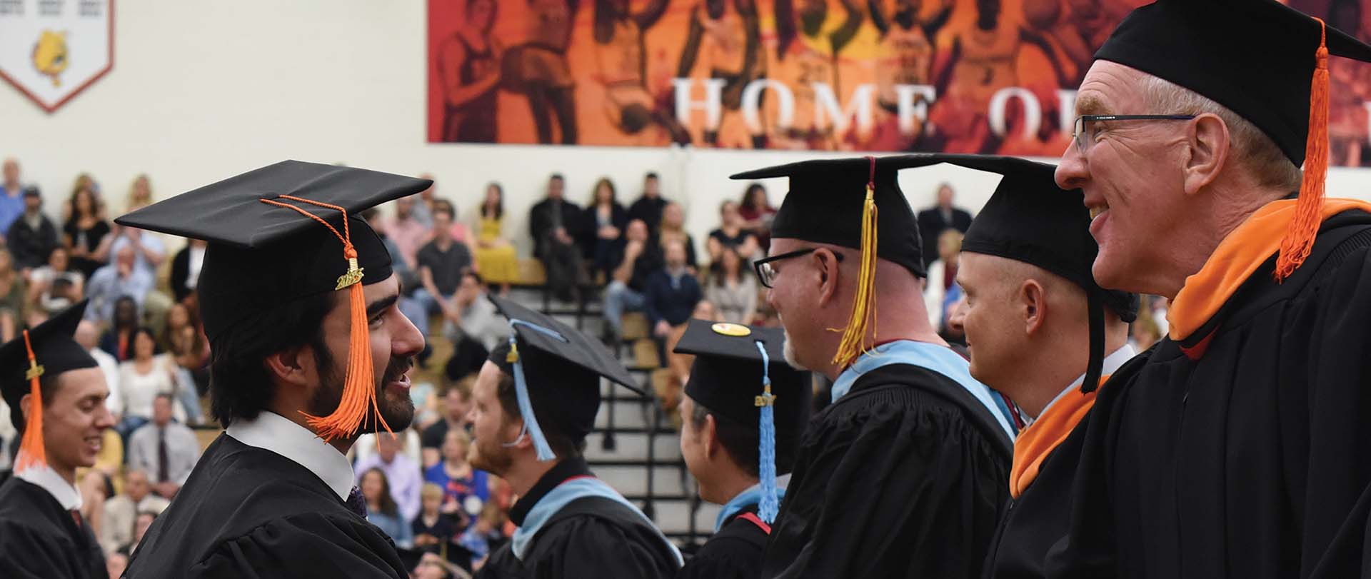 Student and faculty members at a commencement ceremony