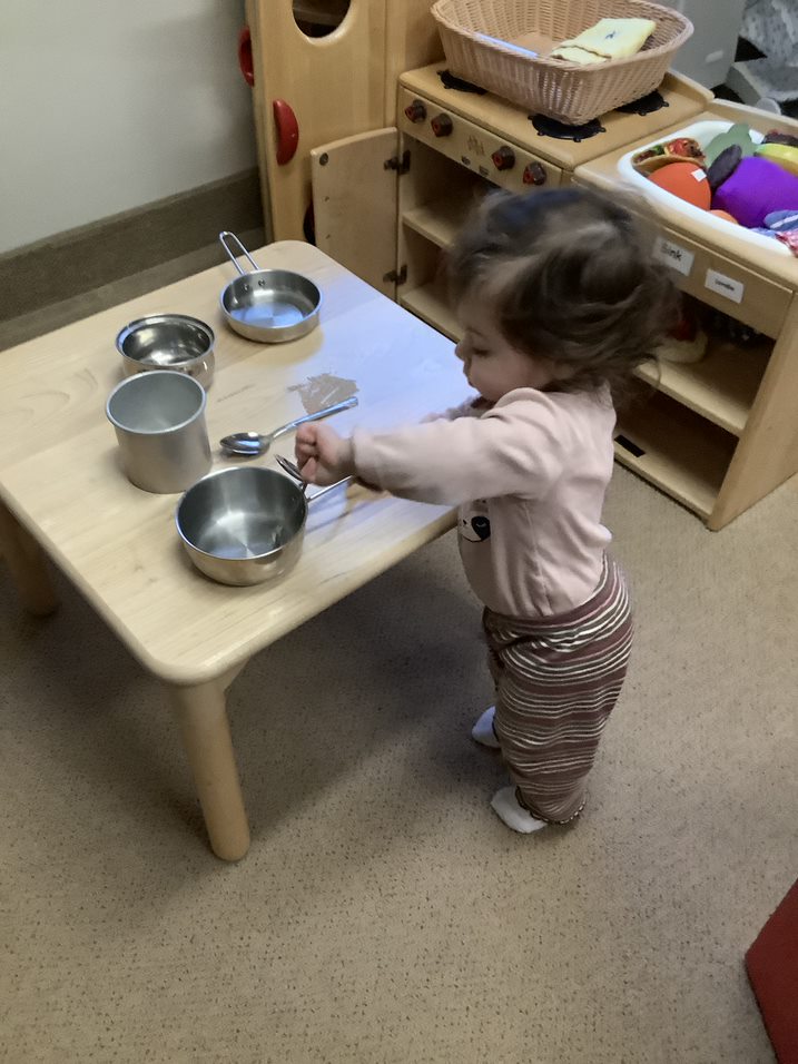 infant with pans