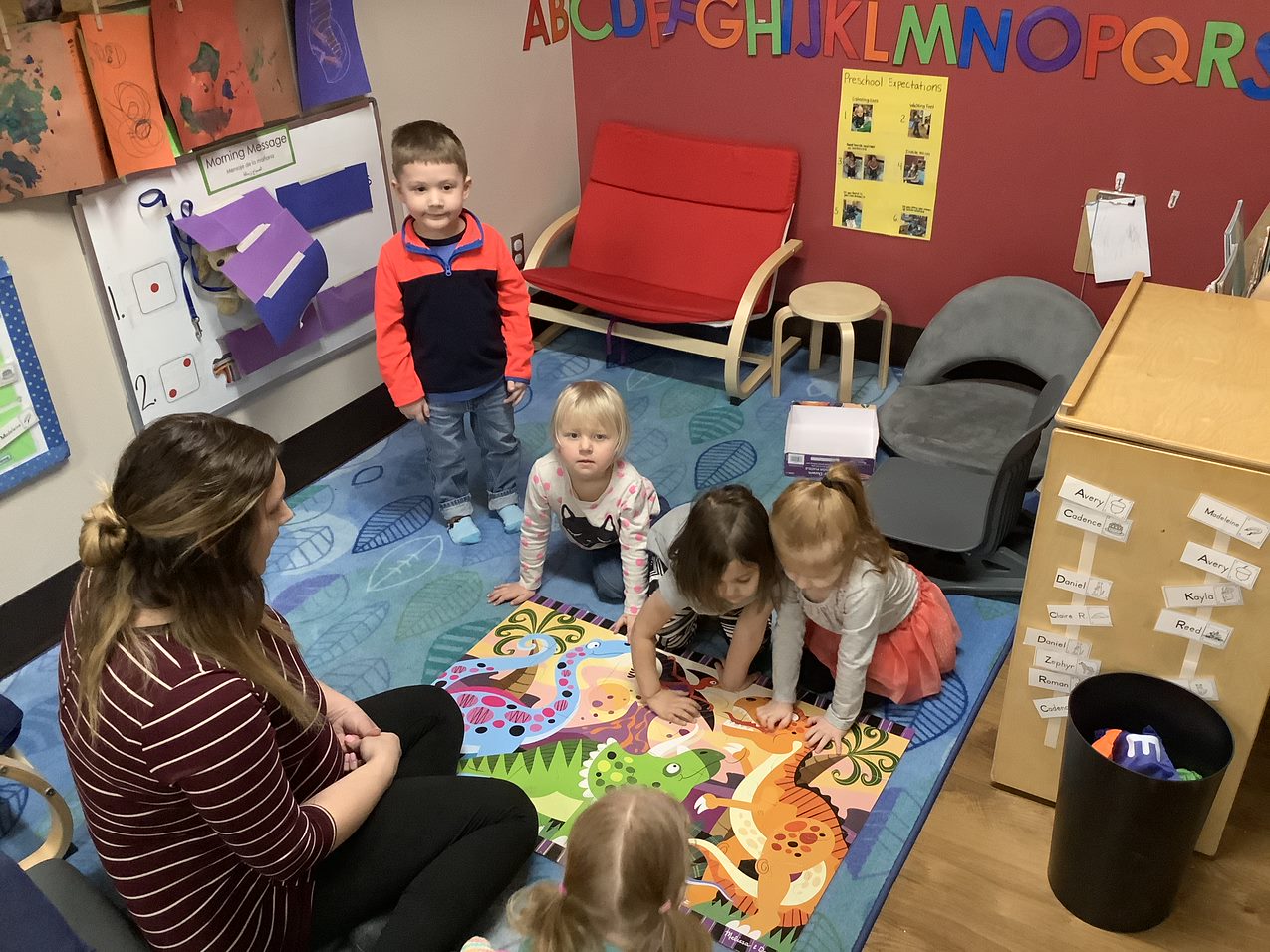 Preschoolers in group with teacher