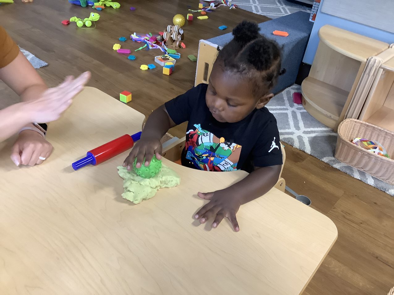 Toddler playing with playdoh