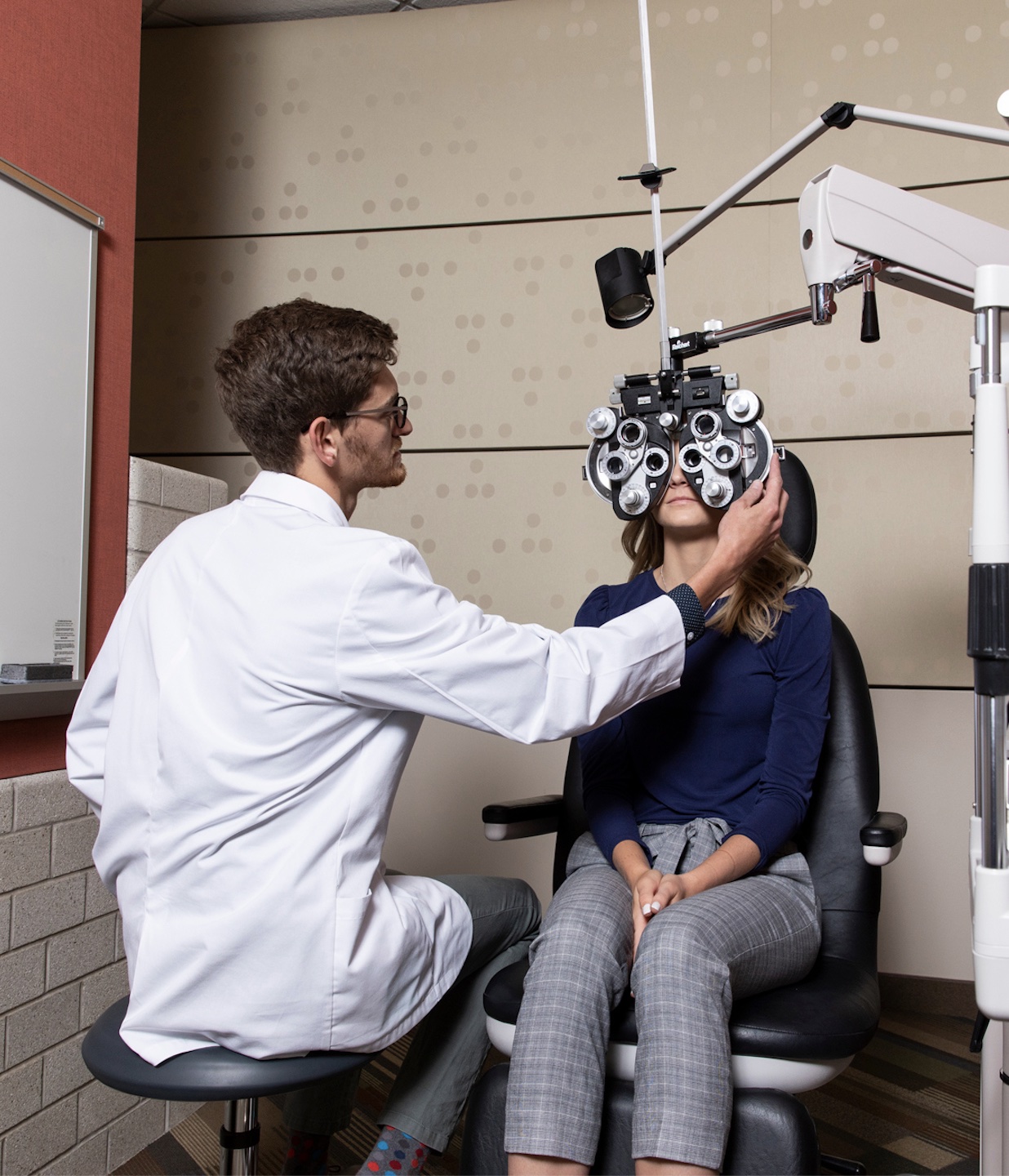 Optometry student working on a patient