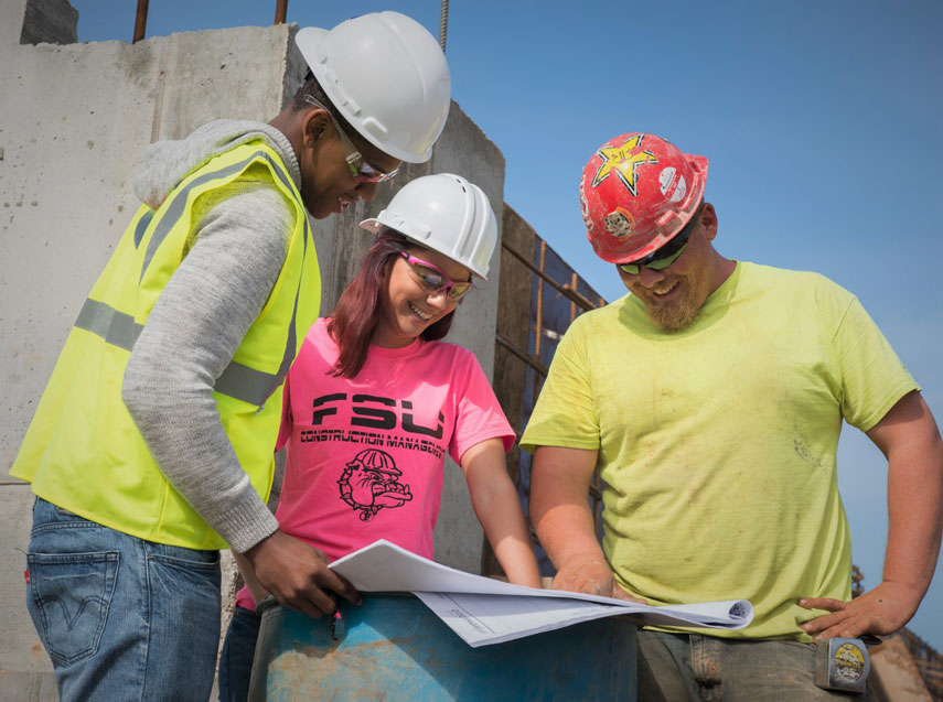 Construction students review blueprints