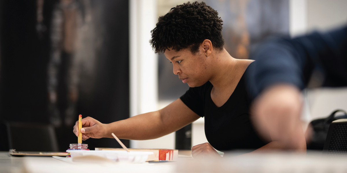 student in art class