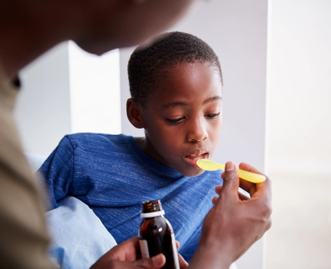 Boy taking antibiotic