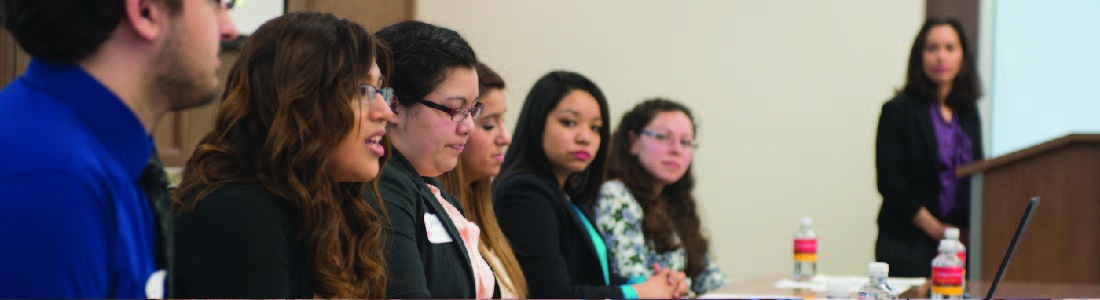 Multiple people sitting on a panel