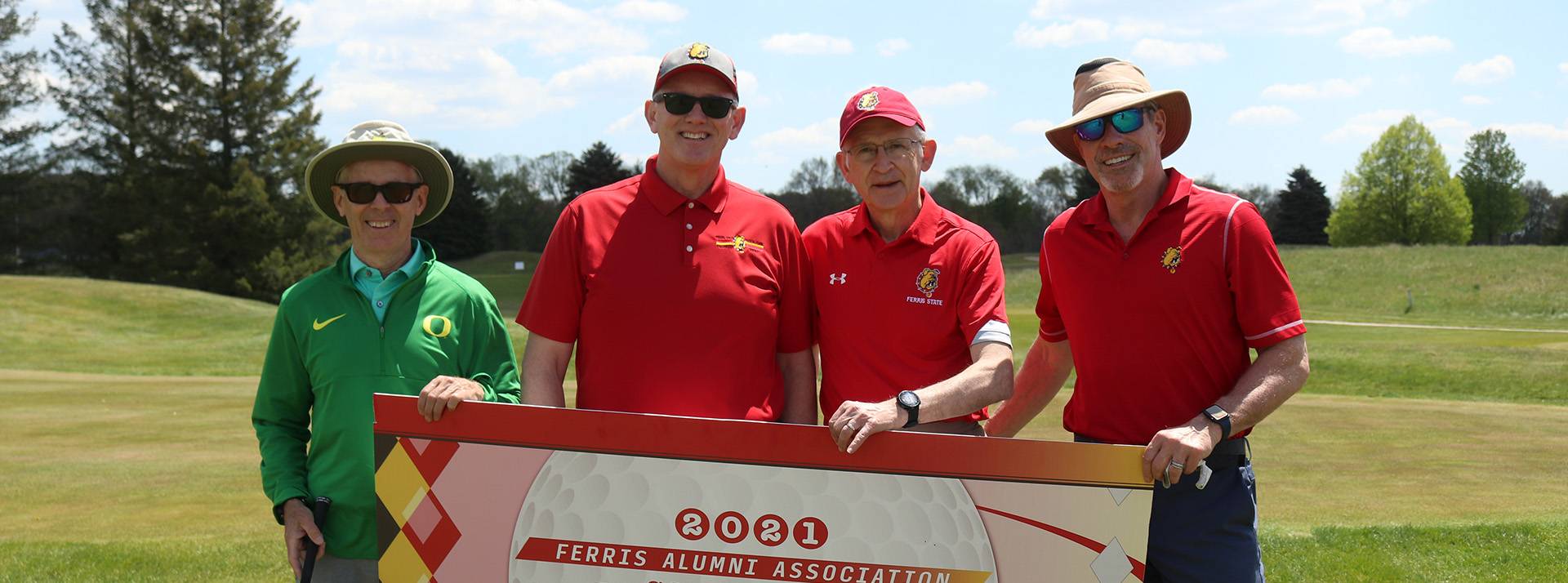 President Eisler and other golfers posing for a picture at the 2021 Ferris State University Alumni Association Golf Outing