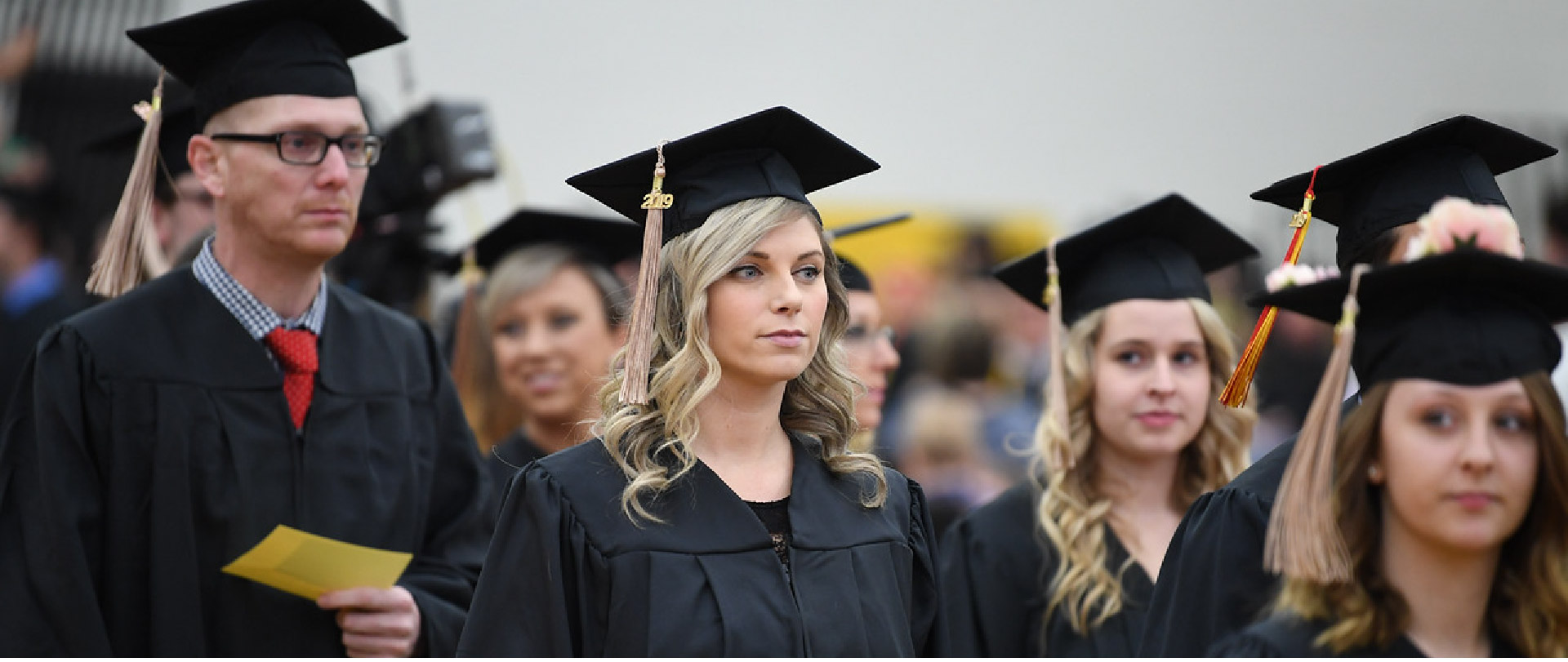 Students at a commencement ceremony