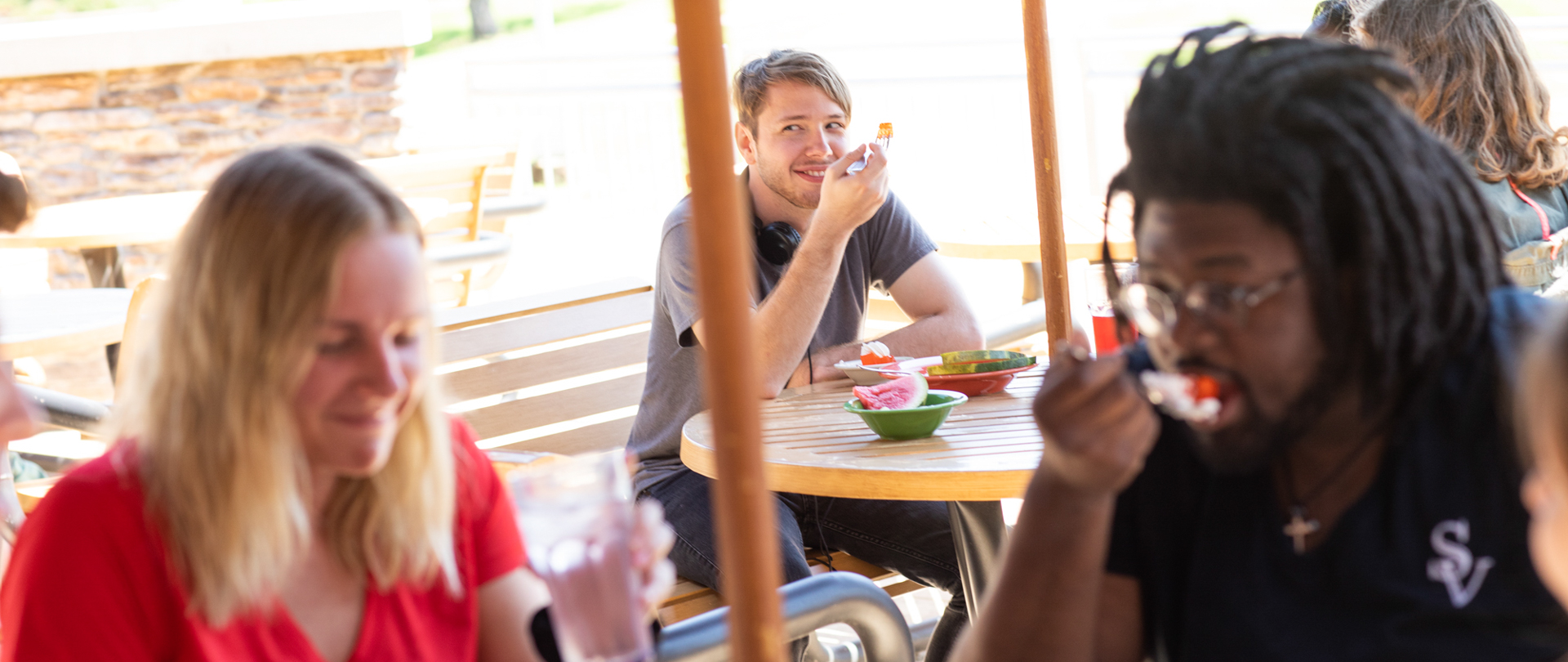 Students eating on the patio at The Rock Cafe on the campus of Ferris State University in Big Rapids, MI