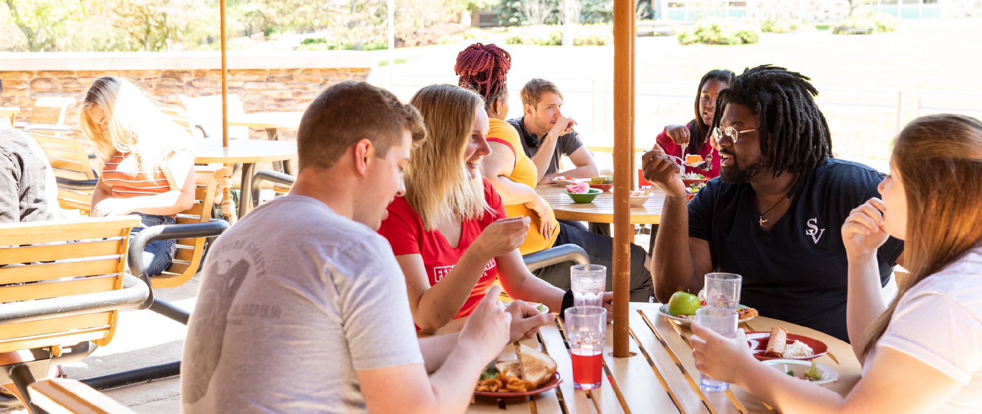 Students dining on the patio at The Rock Cafe on the campus of Ferris State University in Big Rapids, MI